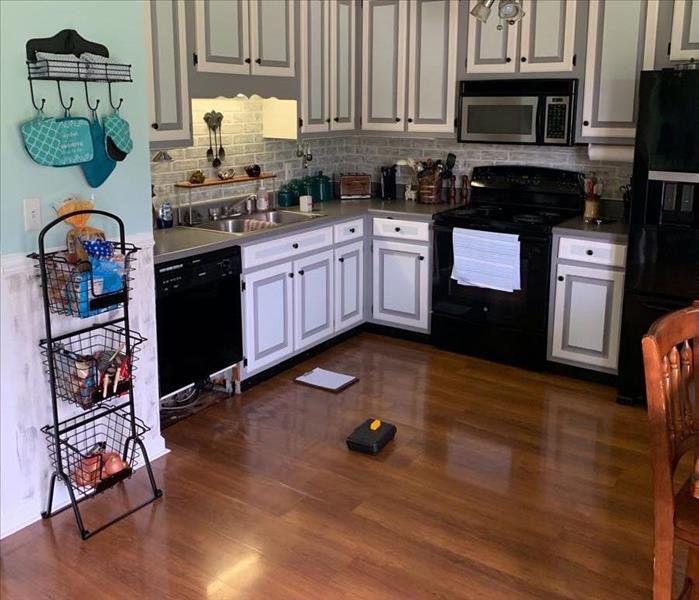 kitchen with water damage from dishwasher 