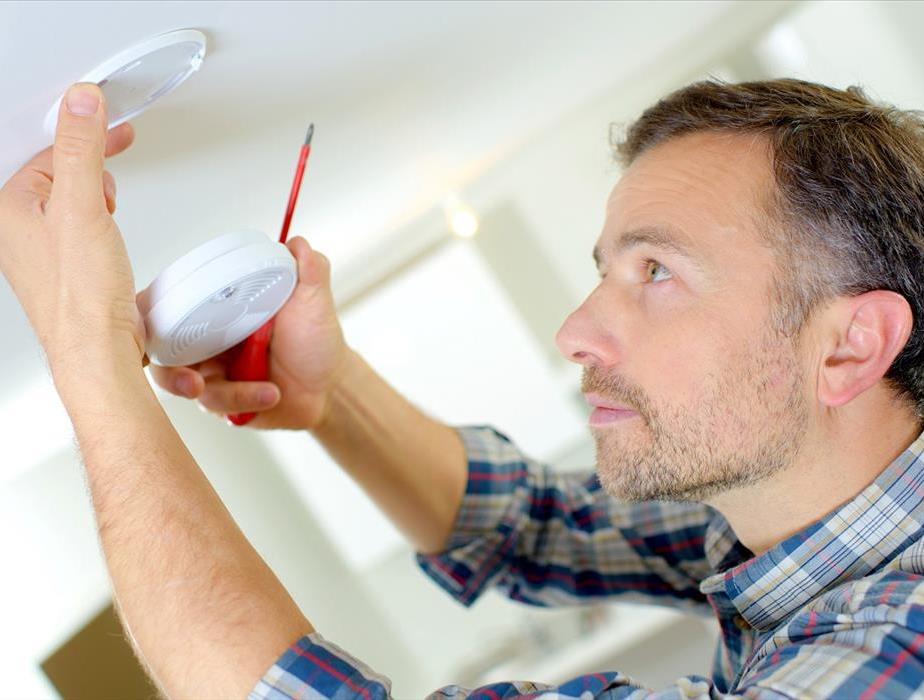 Man Installing Fire ExtinguisherIf you are hoping to improve your household fire safety, it can be overwhelming to know where